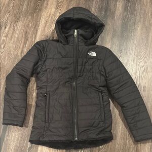 The North Face girls Black Hooded Jacket with polyester “fur” lining